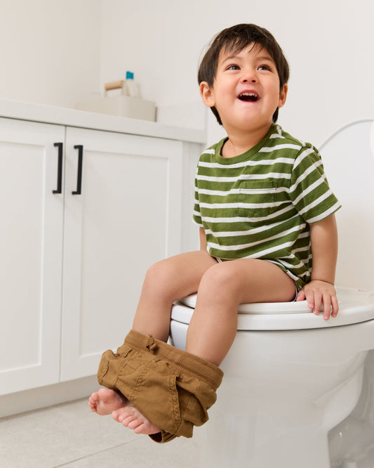 Boy on potty training seat