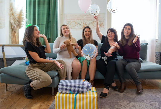 Parent-to-be with friends celebrating a baby shower
