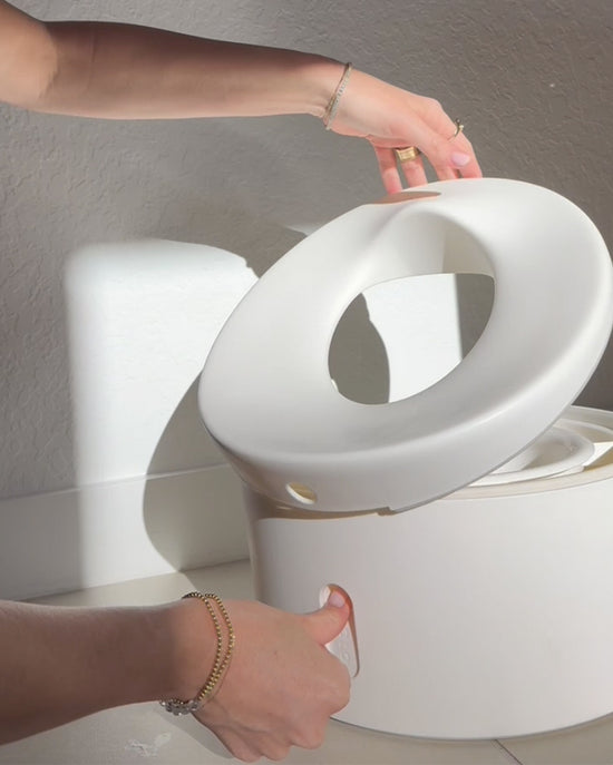 Person opening the potty lid