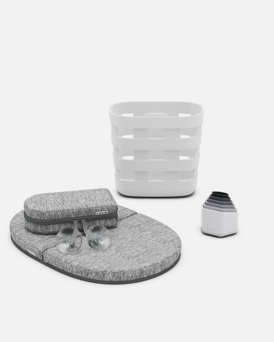 a gray baby bathtub insert and a white plastic piece